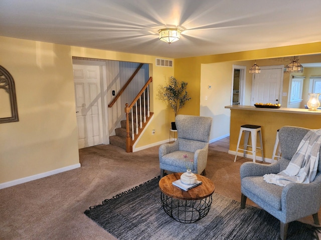 sitting room with dark colored carpet