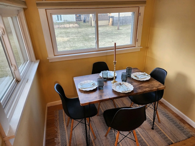 dining area with wood-type flooring