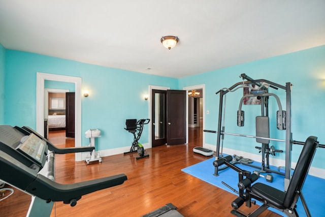 exercise area featuring hardwood / wood-style floors