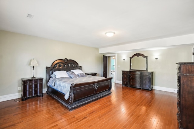 bedroom featuring hardwood / wood-style floors