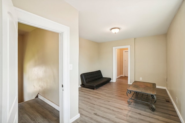 sitting room with light hardwood / wood-style flooring