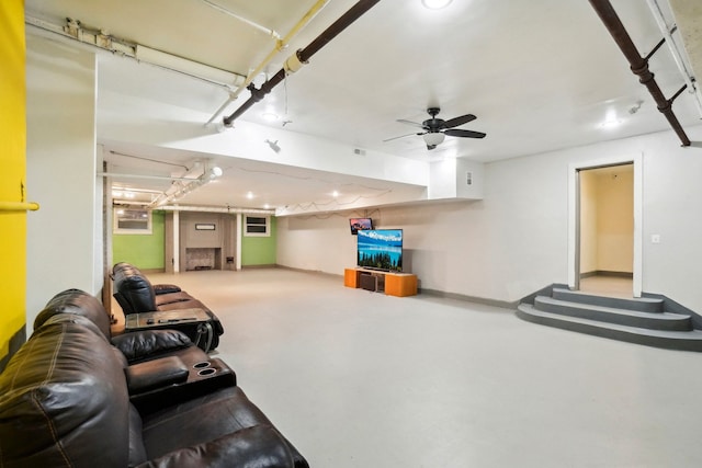 living room with ceiling fan and concrete floors