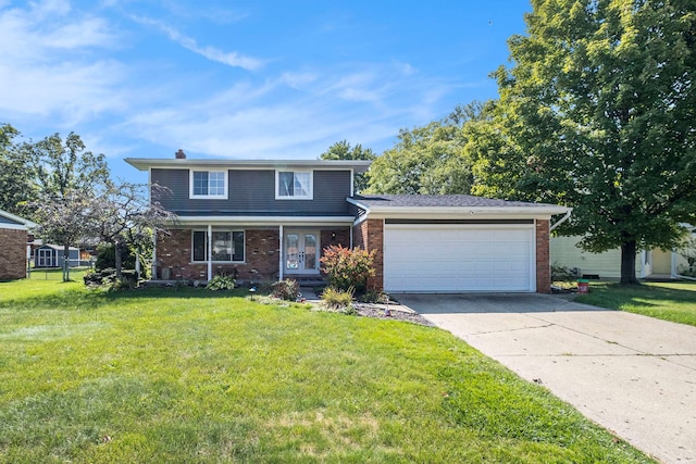 view of front property with a garage and a front lawn