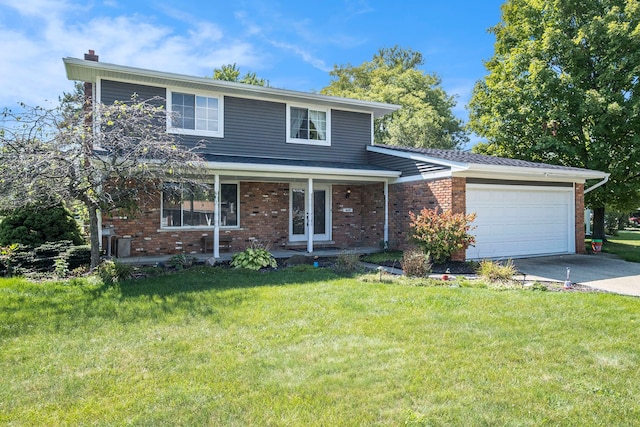 view of property featuring a garage and a front yard