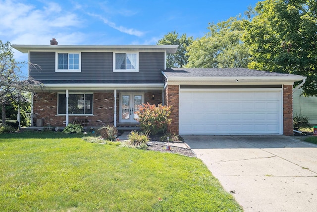 view of front property with a garage and a front lawn