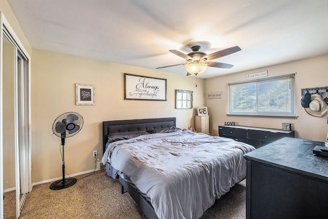 carpeted bedroom with ceiling fan and a closet