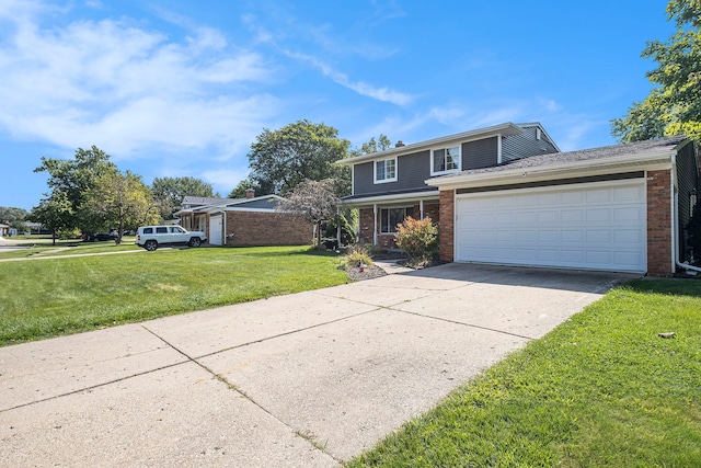 view of property featuring a garage and a front lawn