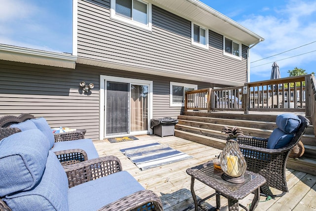 wooden terrace featuring outdoor lounge area