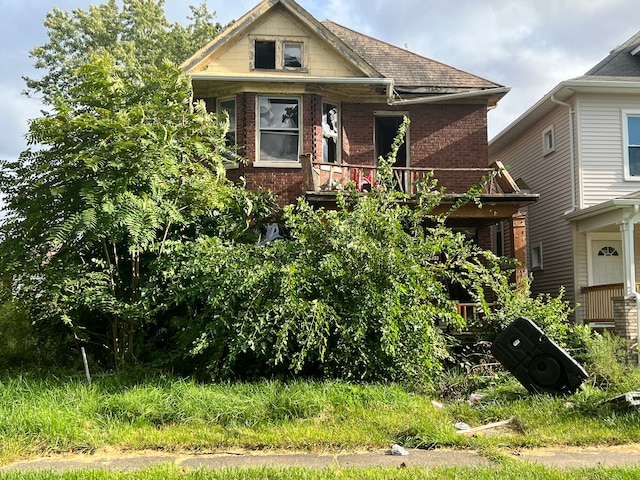 4331 Allendale St, Detroit, MI 48204 - bungalow featuring a balcony, brick siding, and a shingled roof