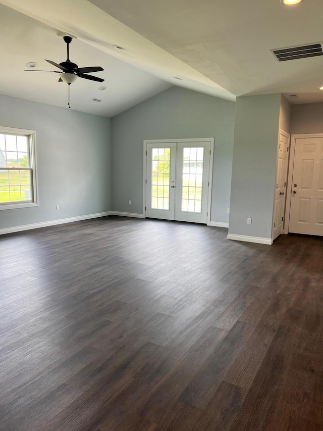 empty room featuring dark hardwood / wood-style floors, a healthy amount of sunlight, ceiling fan, and french doors