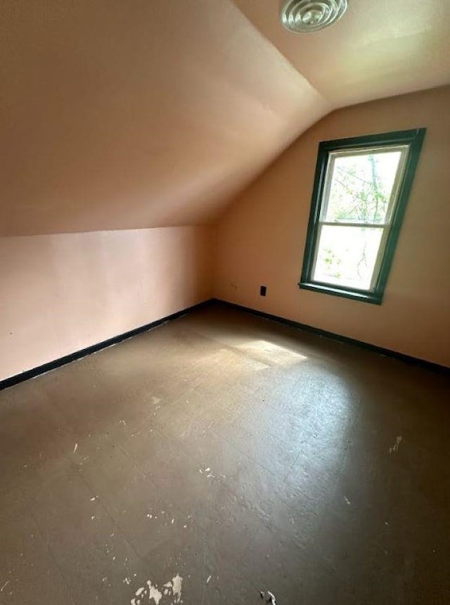 bonus room featuring lofted ceiling