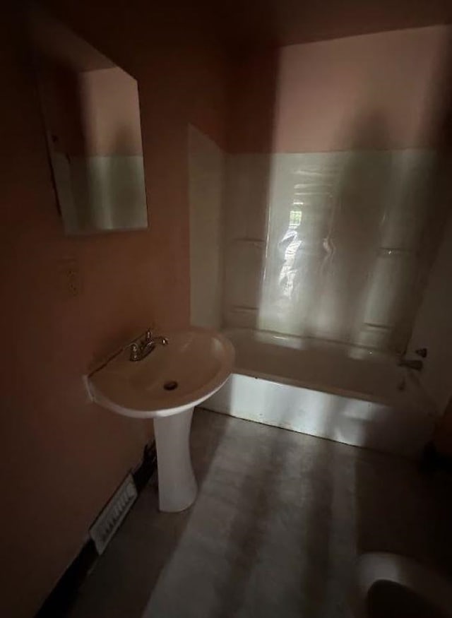 bathroom featuring washtub / shower combination