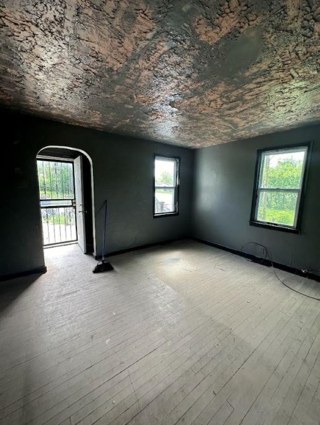 empty room with light hardwood / wood-style flooring