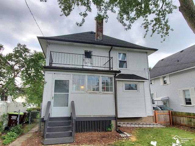 back of house with a balcony