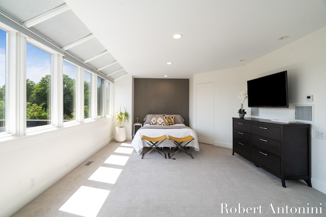 bedroom featuring light carpet