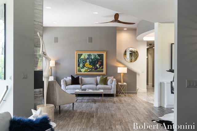 living room featuring hardwood / wood-style flooring and ceiling fan