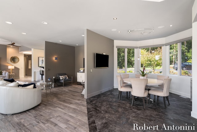 dining space with hardwood / wood-style floors