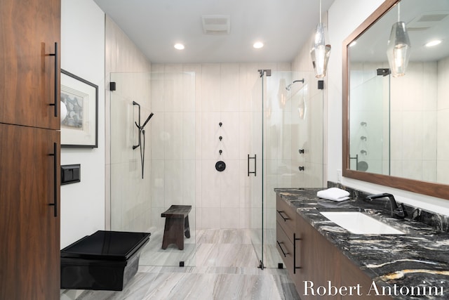 bathroom featuring vanity and walk in shower