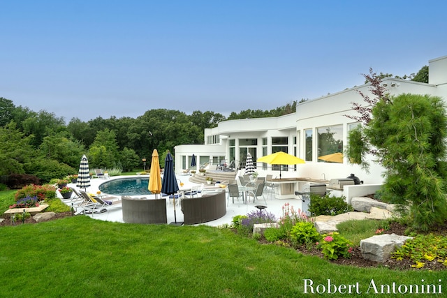 back of property with an outdoor living space, a yard, and a patio area