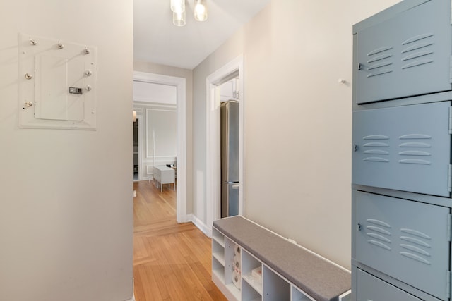 mudroom featuring wood-type flooring and electric panel