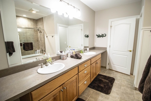 bathroom with tile patterned flooring and vanity