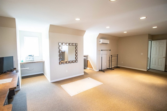 interior space with a wall mounted air conditioner and light colored carpet