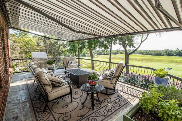 view of patio with an outdoor living space and area for grilling