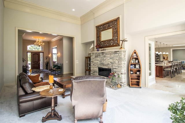 living room featuring light colored carpet, a notable chandelier, a stone fireplace, and ornamental molding