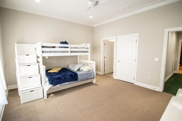 bedroom with carpet flooring, ceiling fan, and crown molding