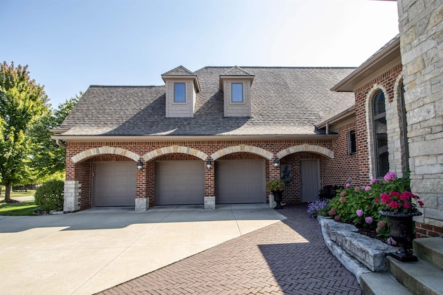 view of front of property featuring a garage