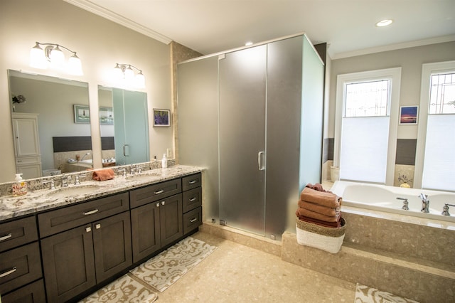 bathroom featuring crown molding, vanity, and independent shower and bath