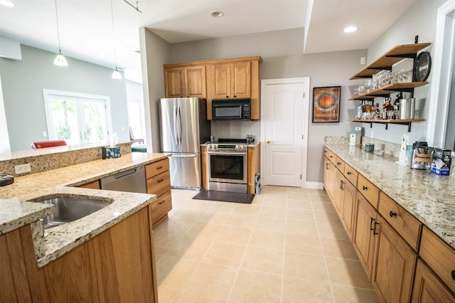 kitchen with light stone countertops, stainless steel appliances, and decorative light fixtures