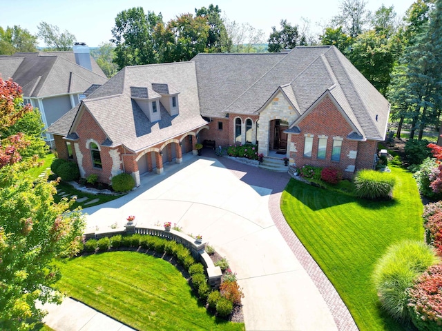 view of front of home featuring a garage and a front lawn