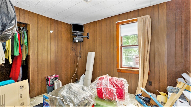 miscellaneous room with wooden walls