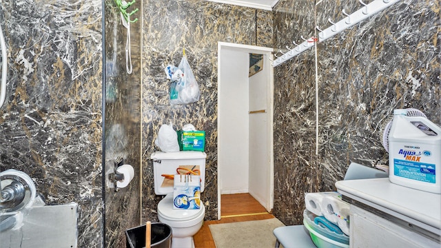 bathroom with tile walls