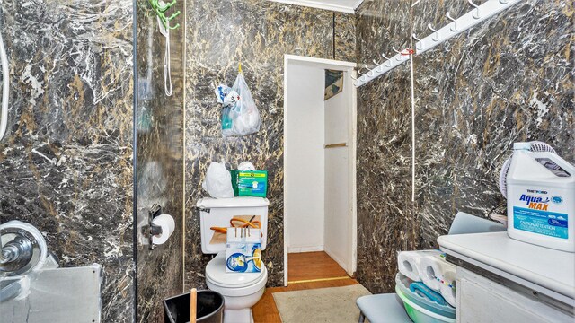 2788 N W Bay Shore Dr, Suttons Bay, MI 49682 - bathroom with toilet and wood finished floors