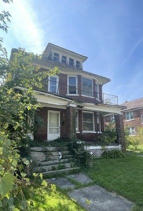 5037 Iroquois St, Detroit, MI 48213 - traditional style home featuring a balcony and covered porch