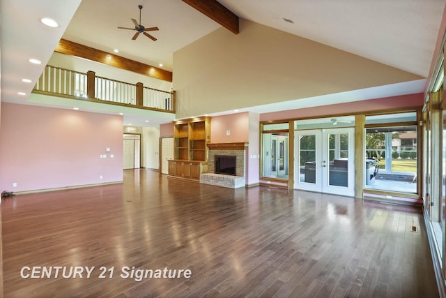 unfurnished living room featuring high vaulted ceiling, french doors, ceiling fan, beamed ceiling, and dark hardwood / wood-style flooring