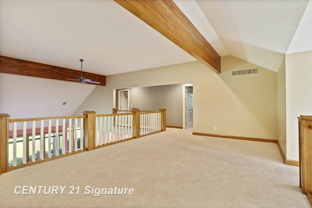 bonus room with lofted ceiling with beams, light colored carpet, and ceiling fan