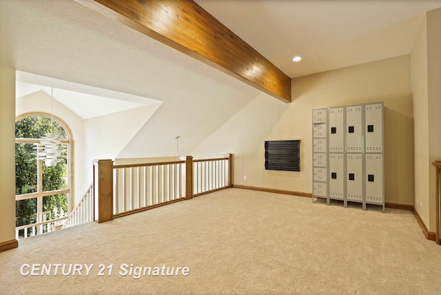 additional living space featuring vaulted ceiling with beams and carpet floors