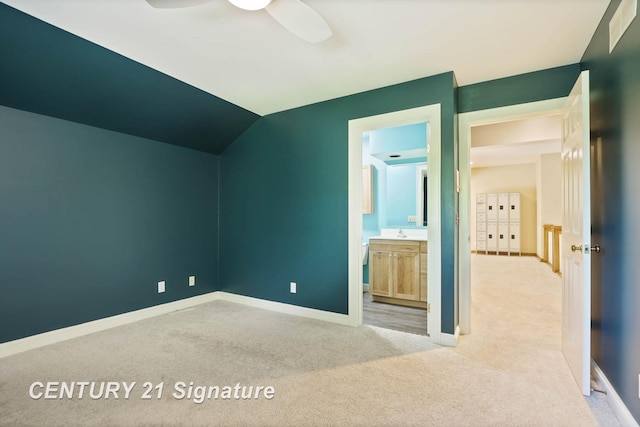 bonus room featuring light carpet, vaulted ceiling, ceiling fan, and sink