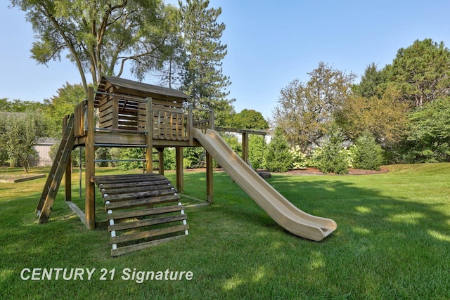 view of playground with a lawn