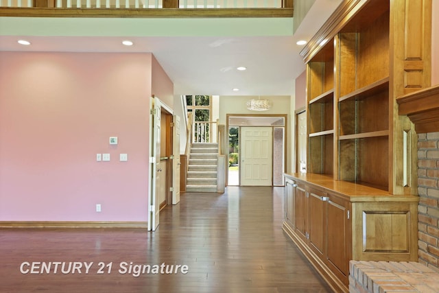 corridor featuring dark hardwood / wood-style flooring