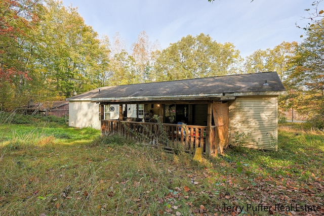 rear view of property with a porch