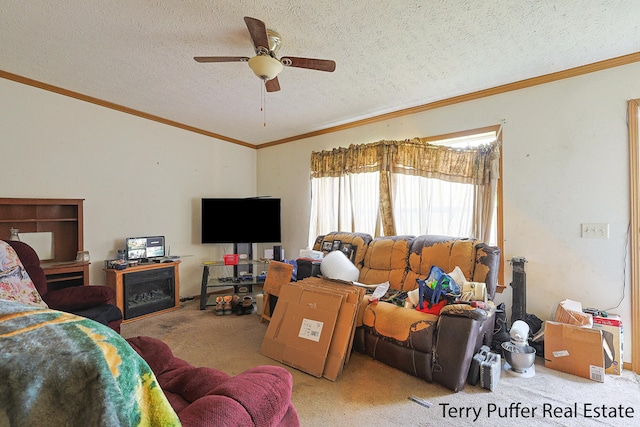 living room featuring a textured ceiling, light colored carpet, ceiling fan, and ornamental molding