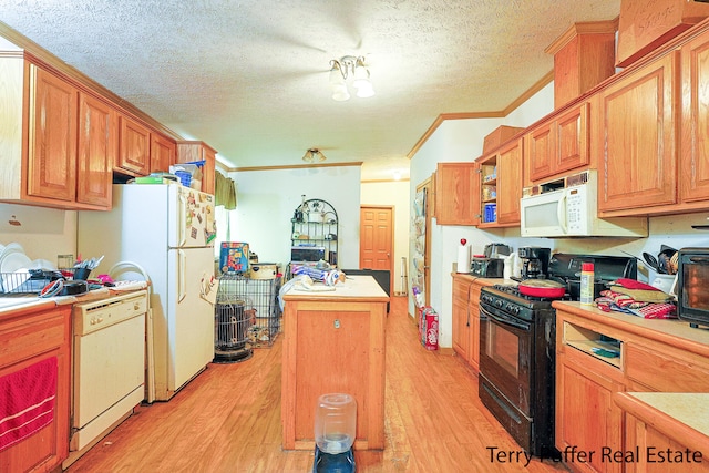 kitchen featuring light wood-type flooring, a textured ceiling, white appliances, crown molding, and a kitchen island