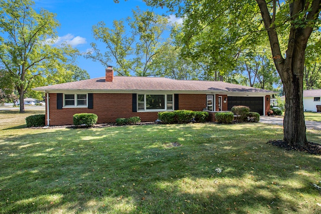 single story home with a garage and a front lawn