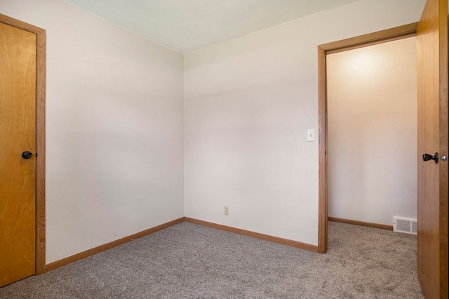 spare room with light colored carpet