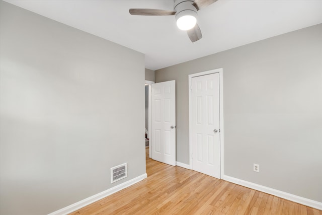 unfurnished bedroom featuring ceiling fan and light wood-type flooring