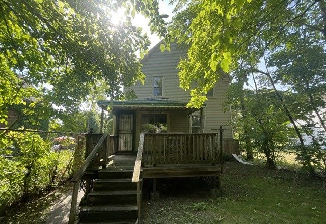 back of house featuring a deck